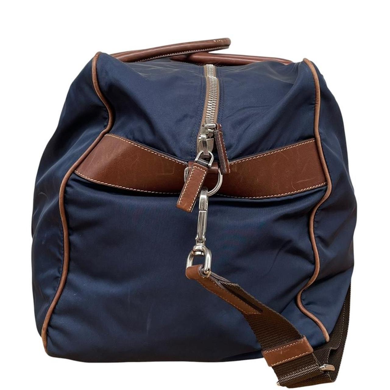 Prada navy blue and brown nylon duffel bag with signature logo and minimal wear.