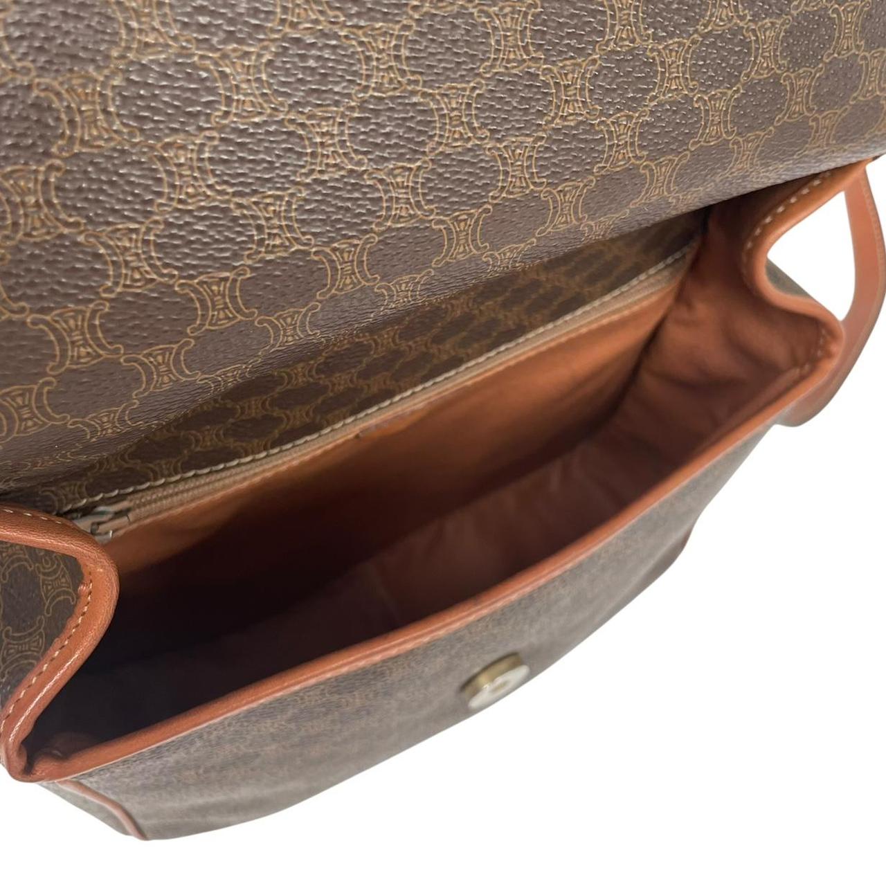 CELINE brown duffel bag with Macadam canvas pattern and logo detail.
