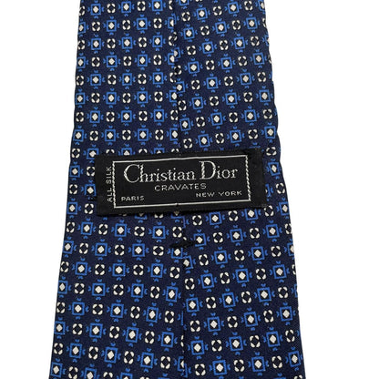 Christian Dior navy blue silk tie with subtle sheen and classic design.