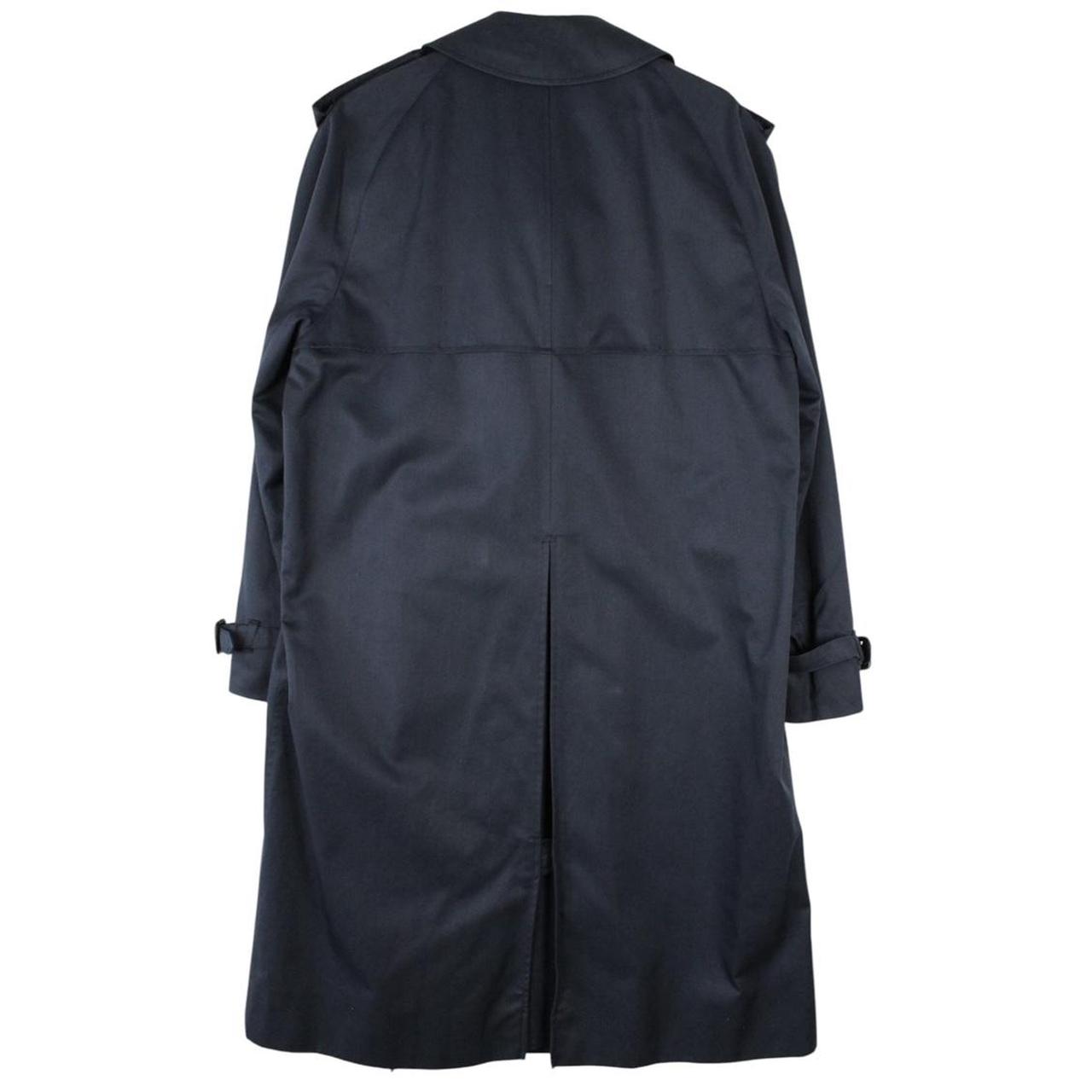 Aquascutum navy blue double breasted trench coat with house check pattern and logo.