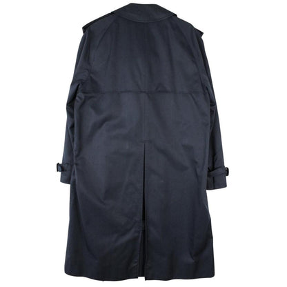 Aquascutum navy blue double breasted trench coat with house check pattern and logo.