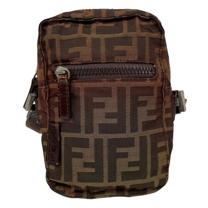 Fendi brown duffel bag with monogram canvas, visible wear and cracking on strap.