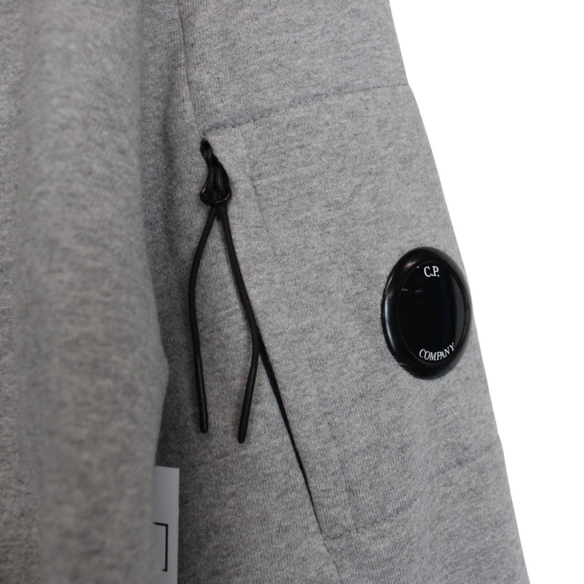 CP Company grey sweatshirt with lens detail and cotton material.