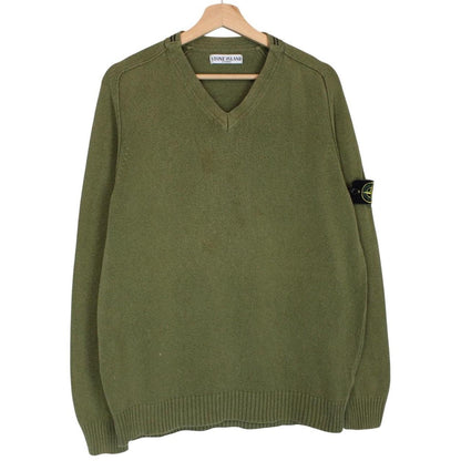 Stone Island green v-neck cotton knit jumper with logo patch and visible wear.