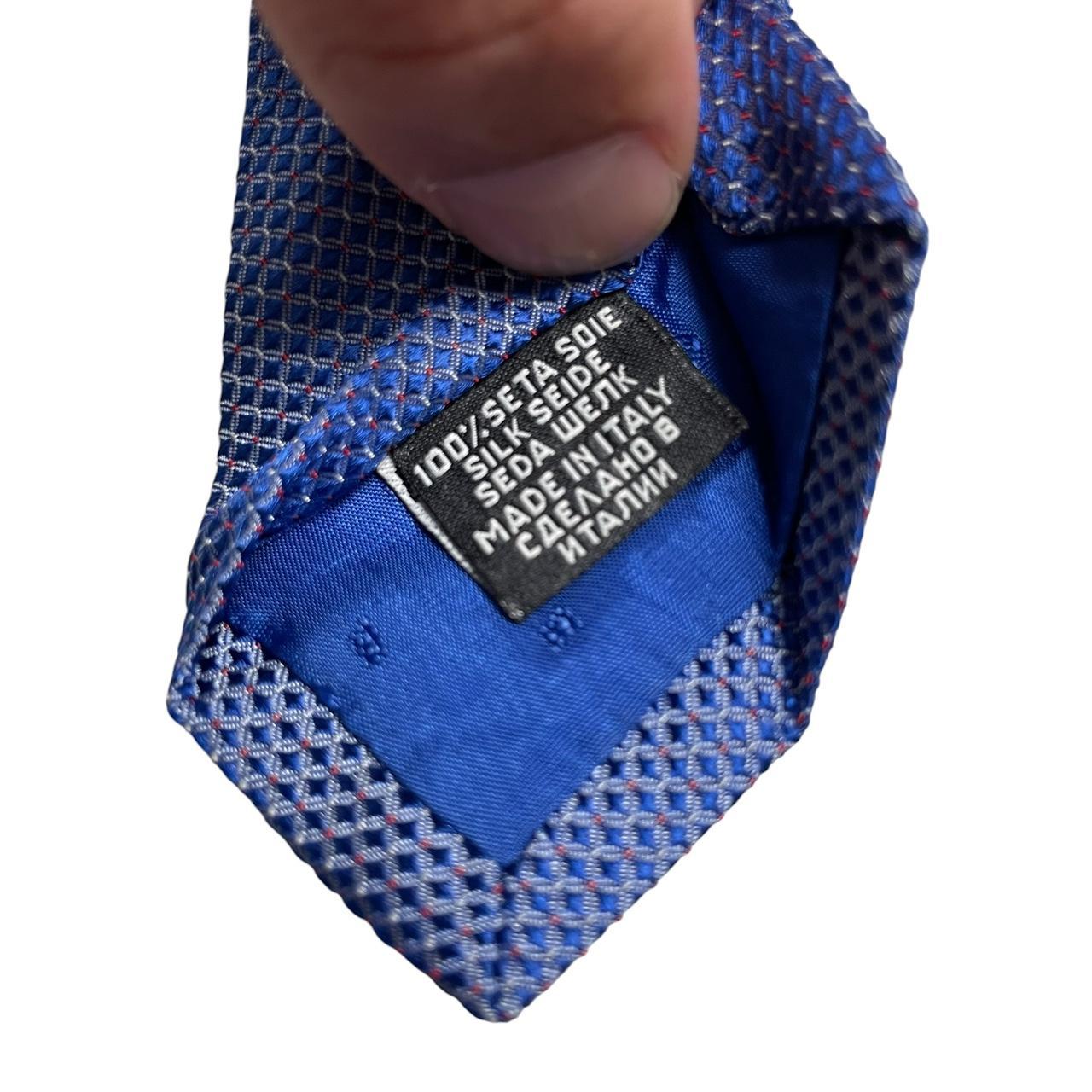 Hugo Boss blue silk tie with smooth texture and subtle sheen.
