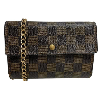 Louis Vuitton gold crossbody wallet Damier Ebene canvas with removable strap and logo.