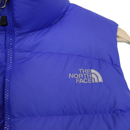 The North Face blue down gilet with logo detail and quilted pattern.