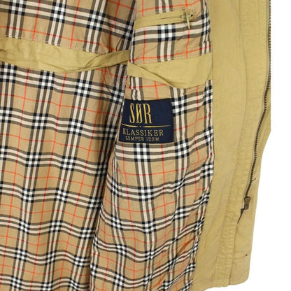 Burberry beige coat with Nova Check pattern, multi pockets, and cream lining.