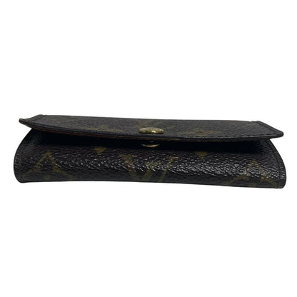 Louis Vuitton brown and tan monogram canvas key case with logo detail.
