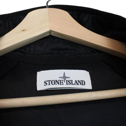 Stone Island black jacket with special process badge and full zip design.