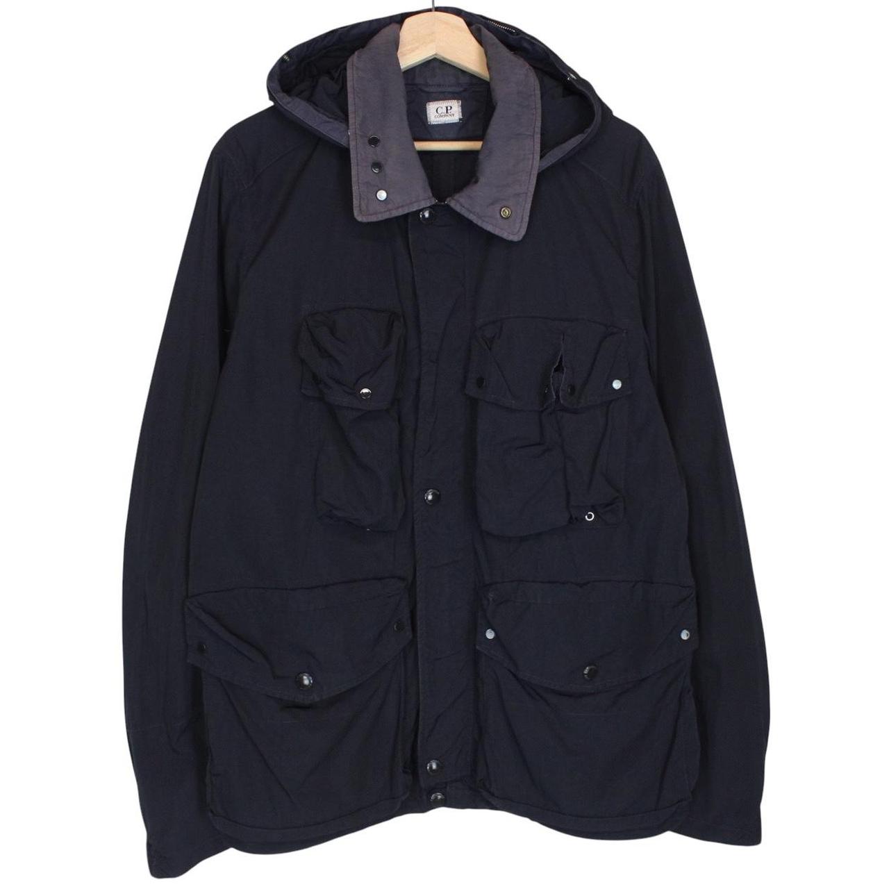 CP Company navy blue nylon jacket with multi pockets and garment dyed finish.