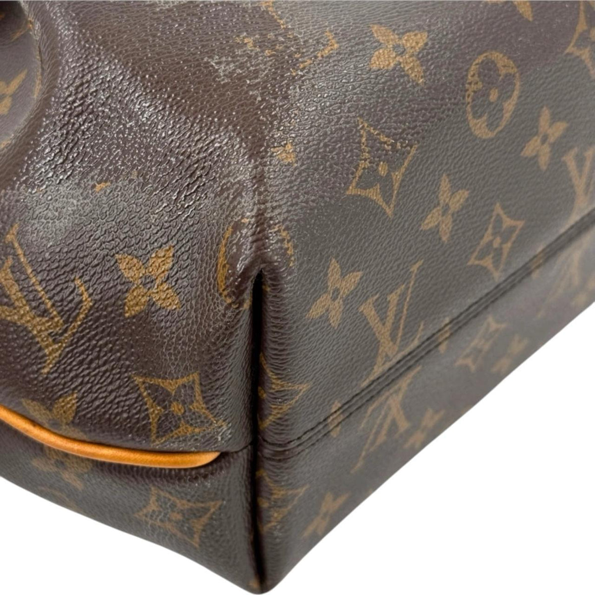 Louis Vuitton brown messenger bag with monogram canvas and leather trim details.