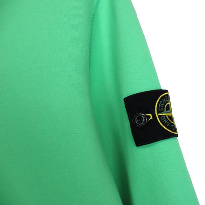 Stone Island green cotton sweatshirt with iconic compass logo and ribbed cuffs.