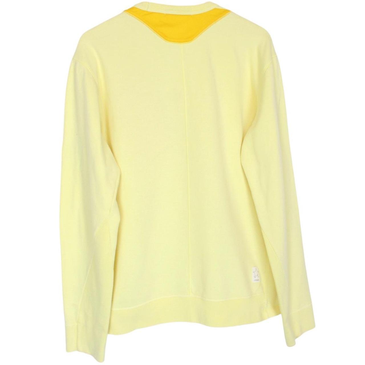 Stone Island yellow v-neck sweatshirt with logo patch and soft cotton material.