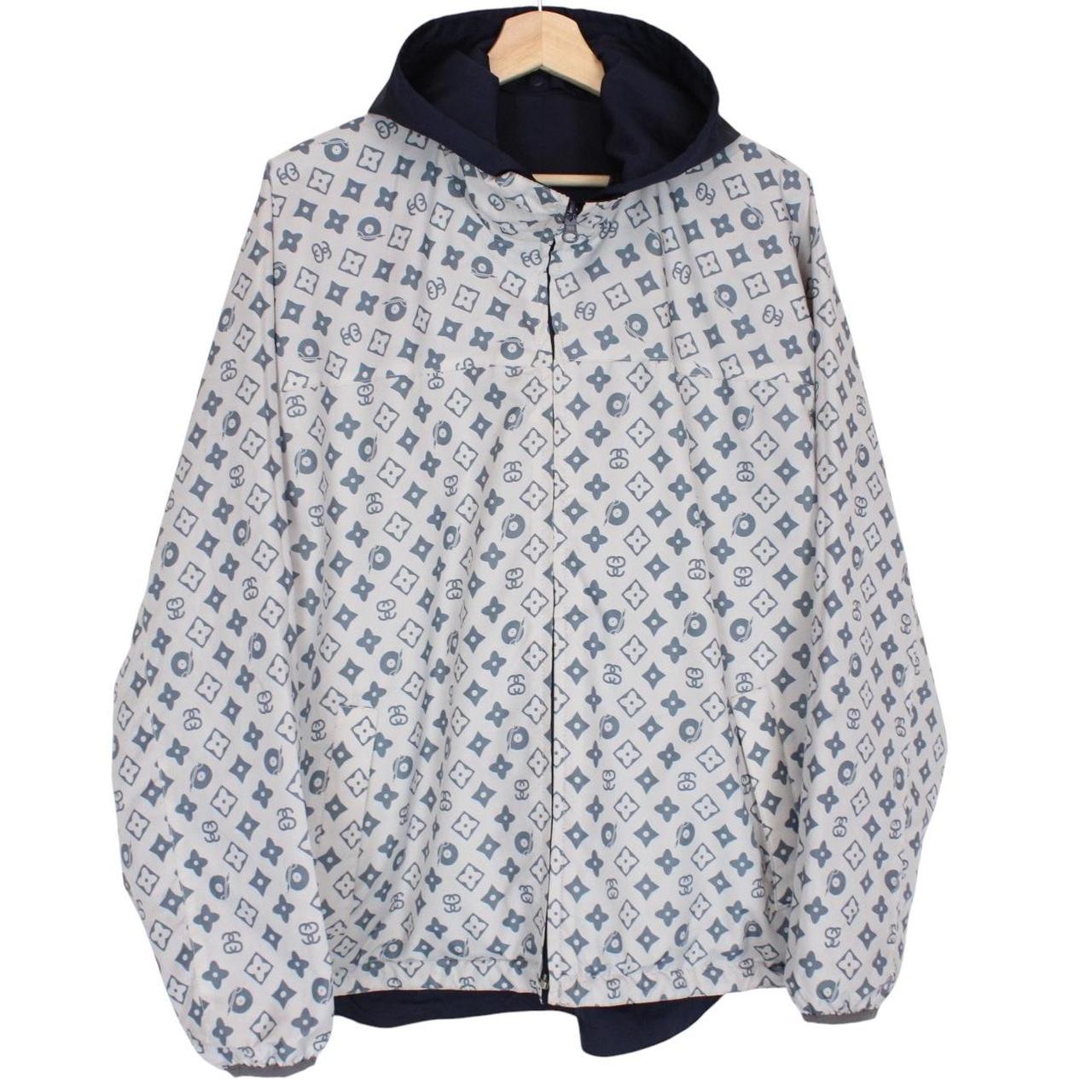 Stüssy reversible nylon jacket in grey and navy blue with logo detailing.