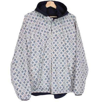 Stüssy reversible nylon jacket in grey and navy blue with logo detailing.