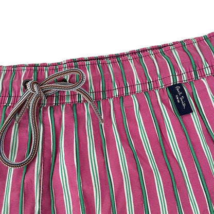 Paul Smith red swim shorts with striped pattern and cotton material.