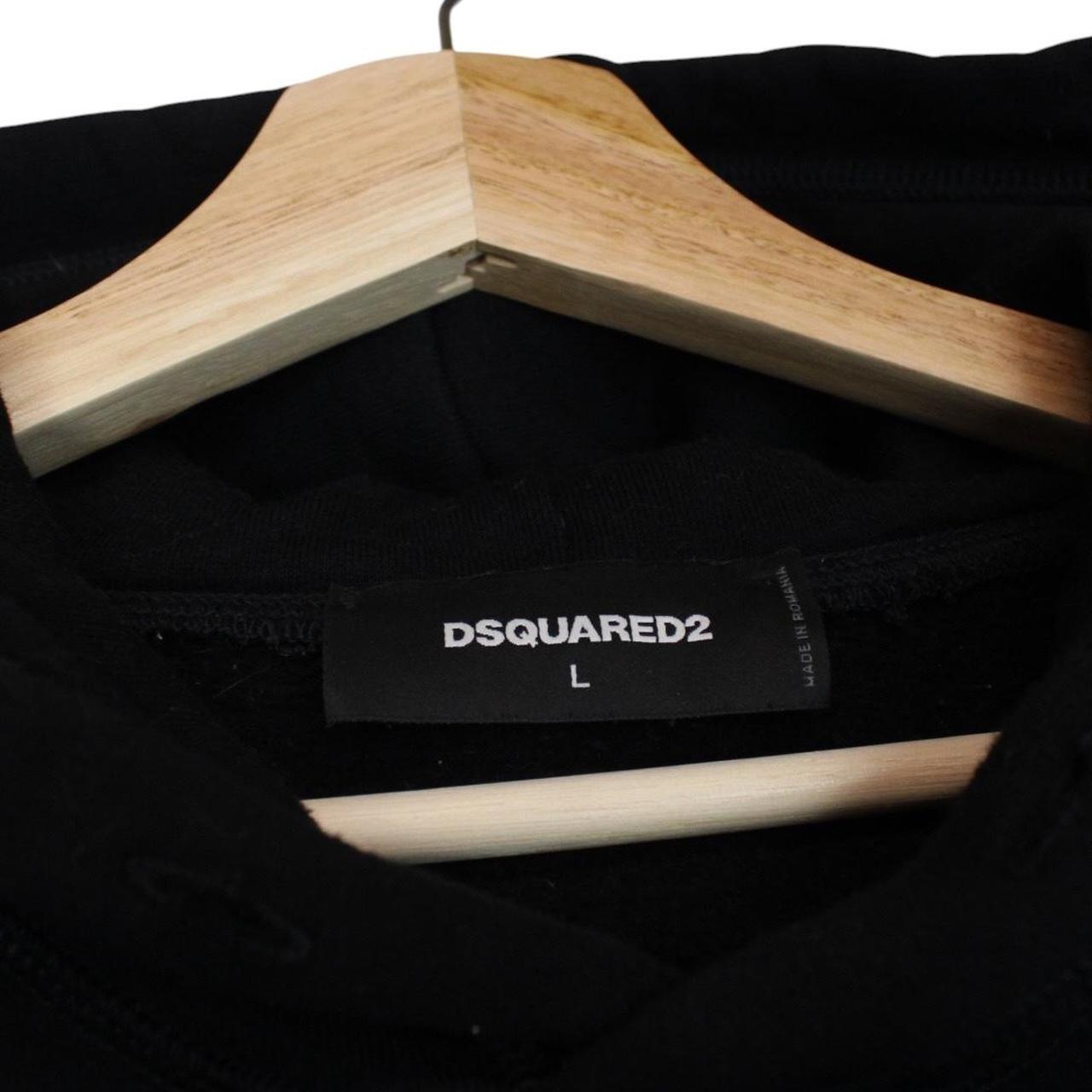 Dsquared2 black hoodie with white logo print and minor wear details.