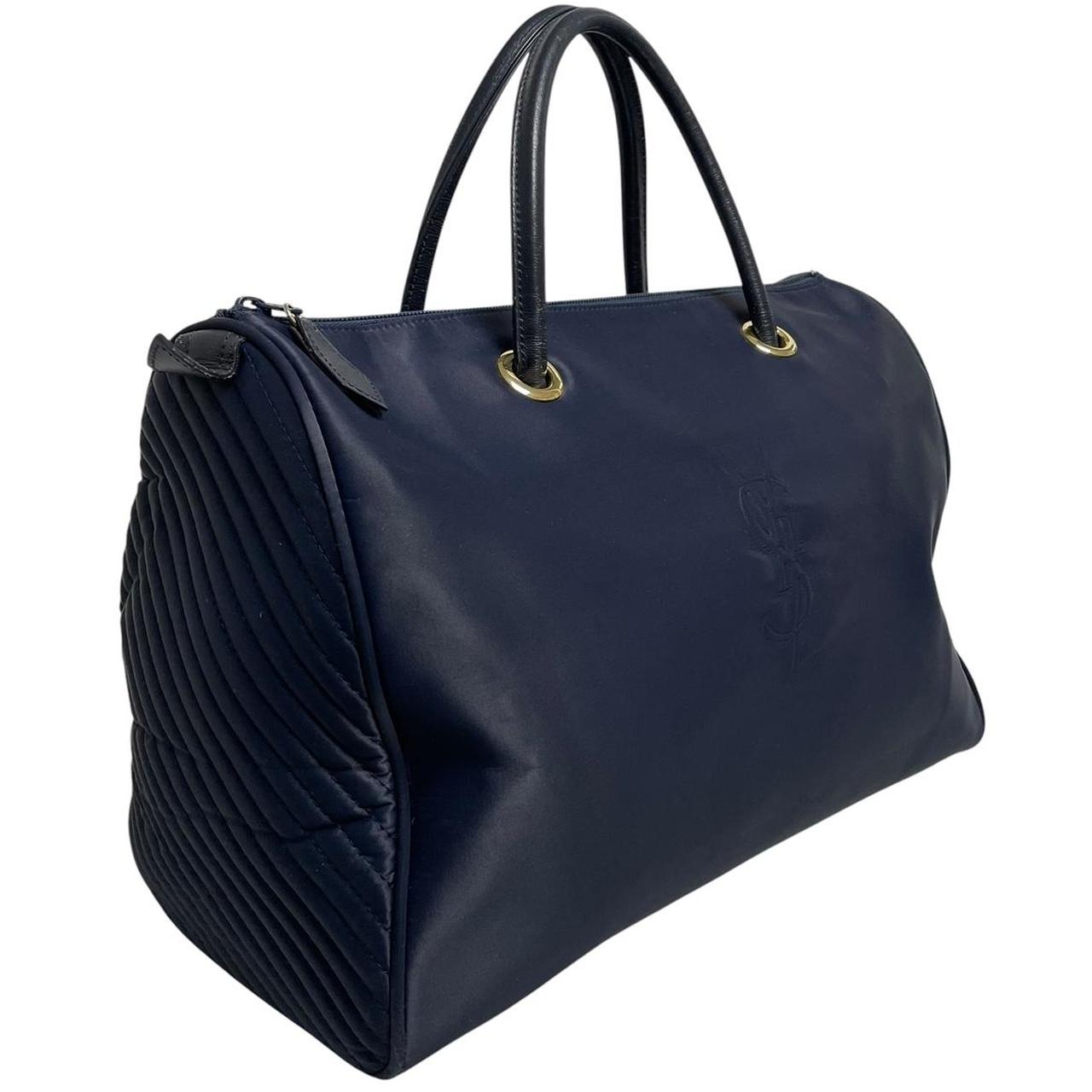 Yves Saint Laurent navy blue duffel bag embossed logo nylon material with handles.