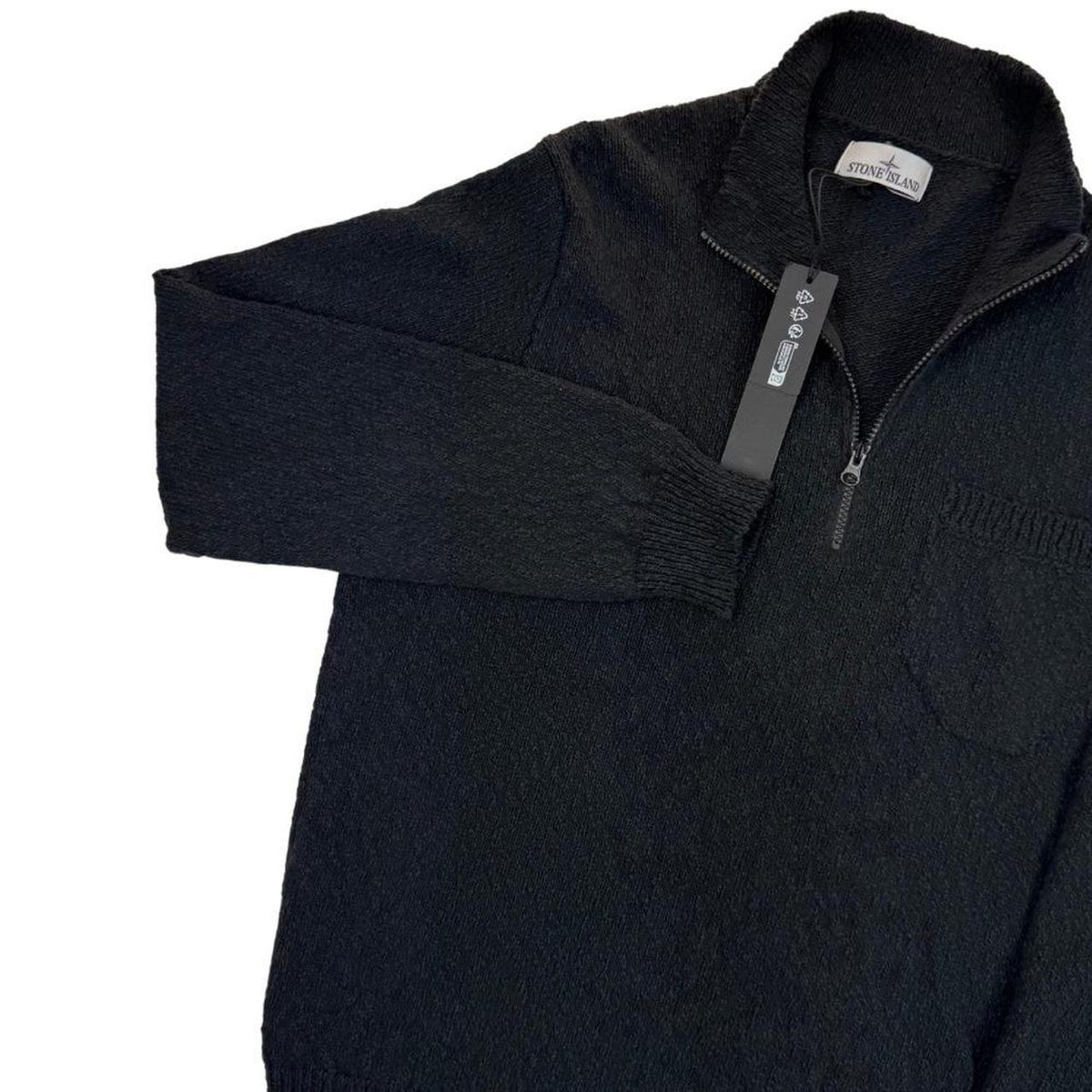Stone Island black knit jumper with logo patch and cotton-linen blend material.