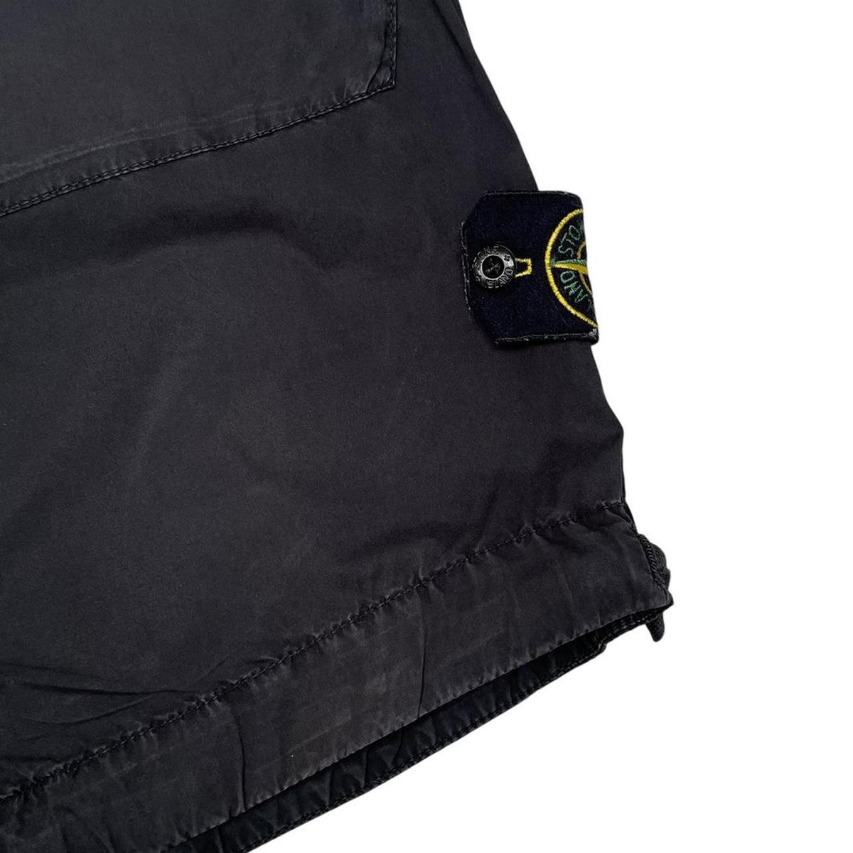 Stone Island black cargo shorts with logo patch and cotton material, size medium.