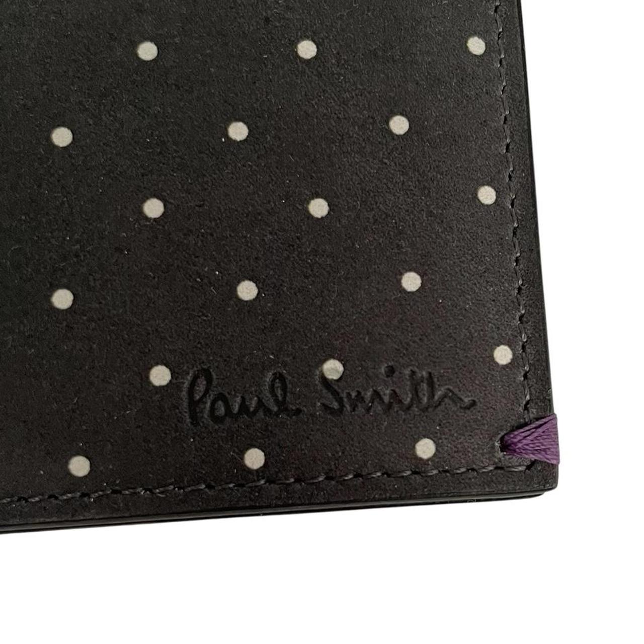 Paul Smith grey leather bifold wallet with polka dot pattern and embossed logo.