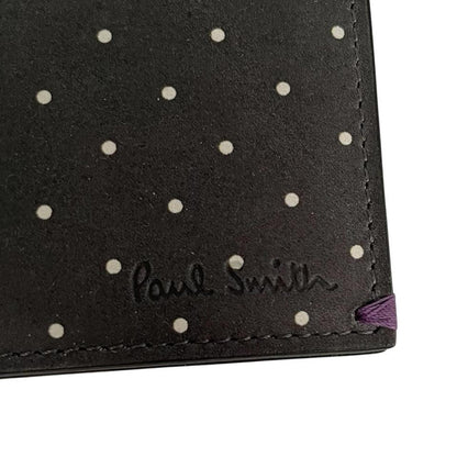 Paul Smith grey leather bifold wallet with polka dot pattern and embossed logo.