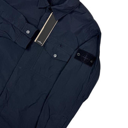 Stone Island navy blue nylon overshirt jacket with ghost logo and smooth texture.