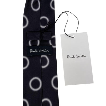 Paul Smith black and white silk tie with circular print and square cut design.