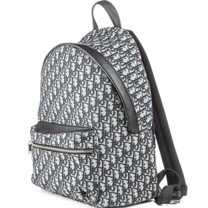Dior beige and black oblique jacquard monogram rider backpack with logo pattern.