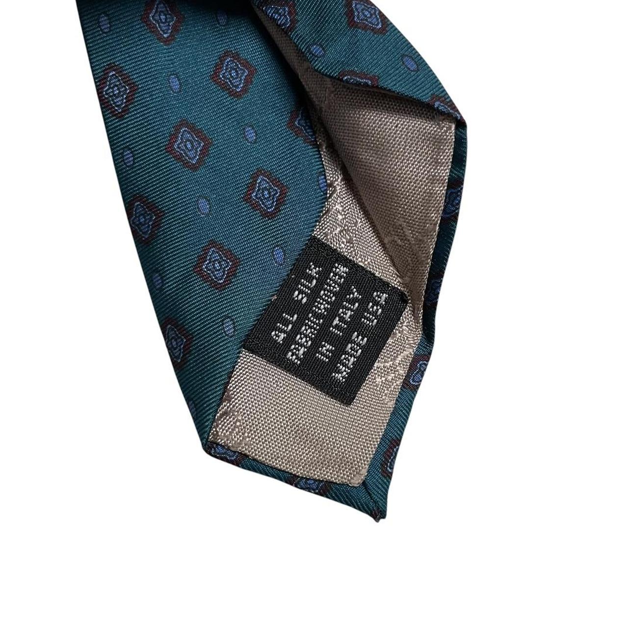 Christian Dior blue silk tie with subtle sheen and classic design.