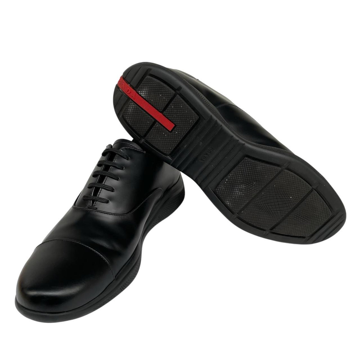 Prada black leather laced derby loafers with subtle signs of wear, includes original dust bags.
