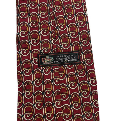 Gucci burgundy silk tie with vintage pattern and signature logo detail.