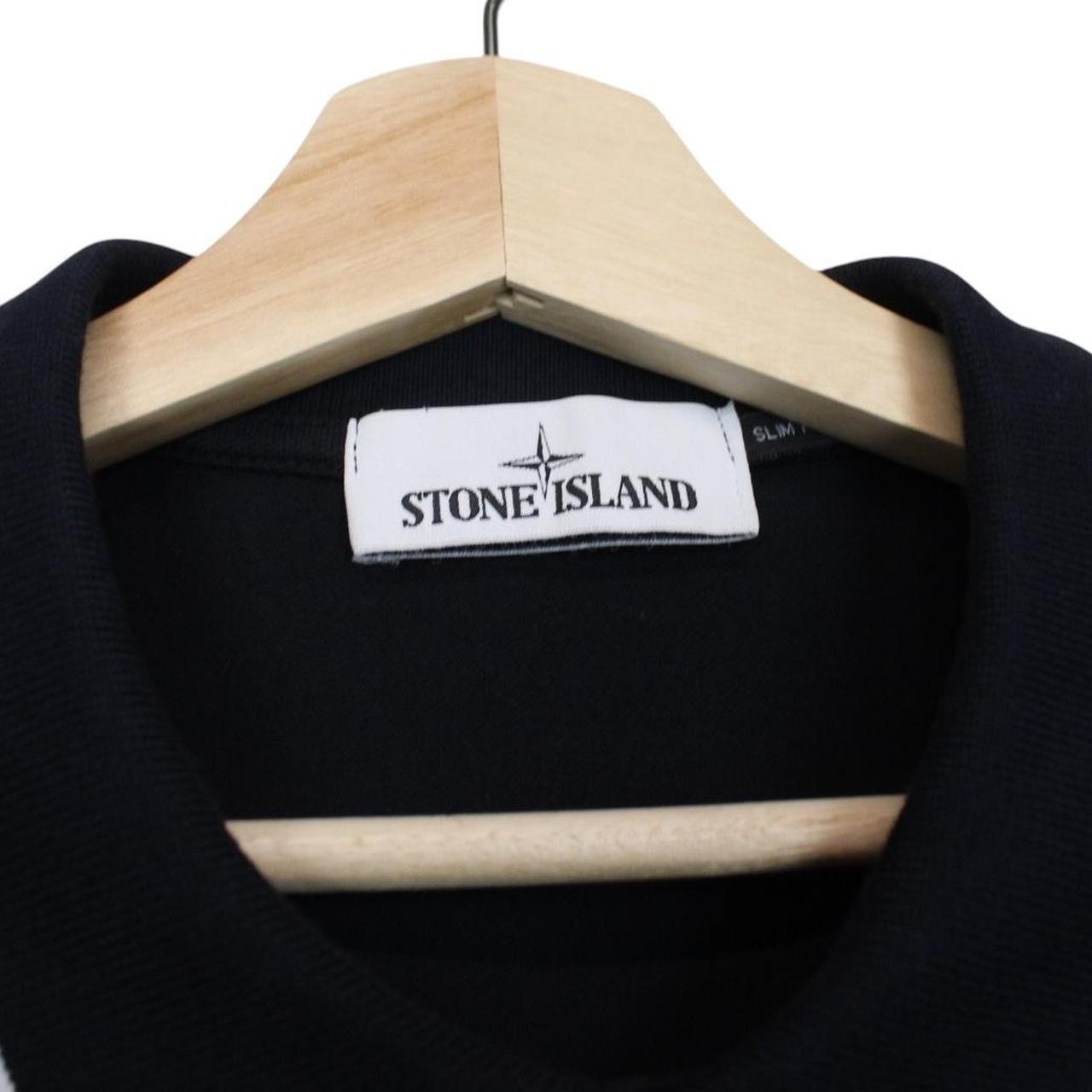 Stone Island navy blue short sleeve polo shirt with compass logo and cotton material.