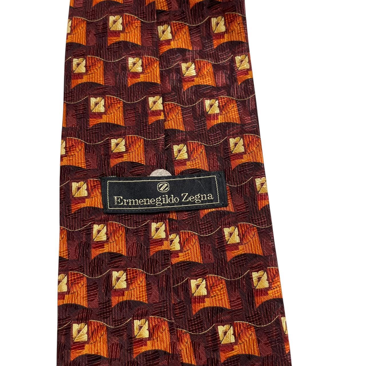 Ermenegildo Zegna brown and orange silk tie with abstract print design.