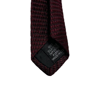 DKNY burgundy silk tie with subtle sheen and classic design.