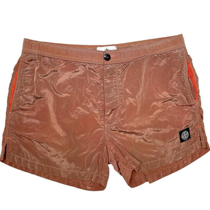 Stone Island orange swim shorts with logo patch and nylon metal material.