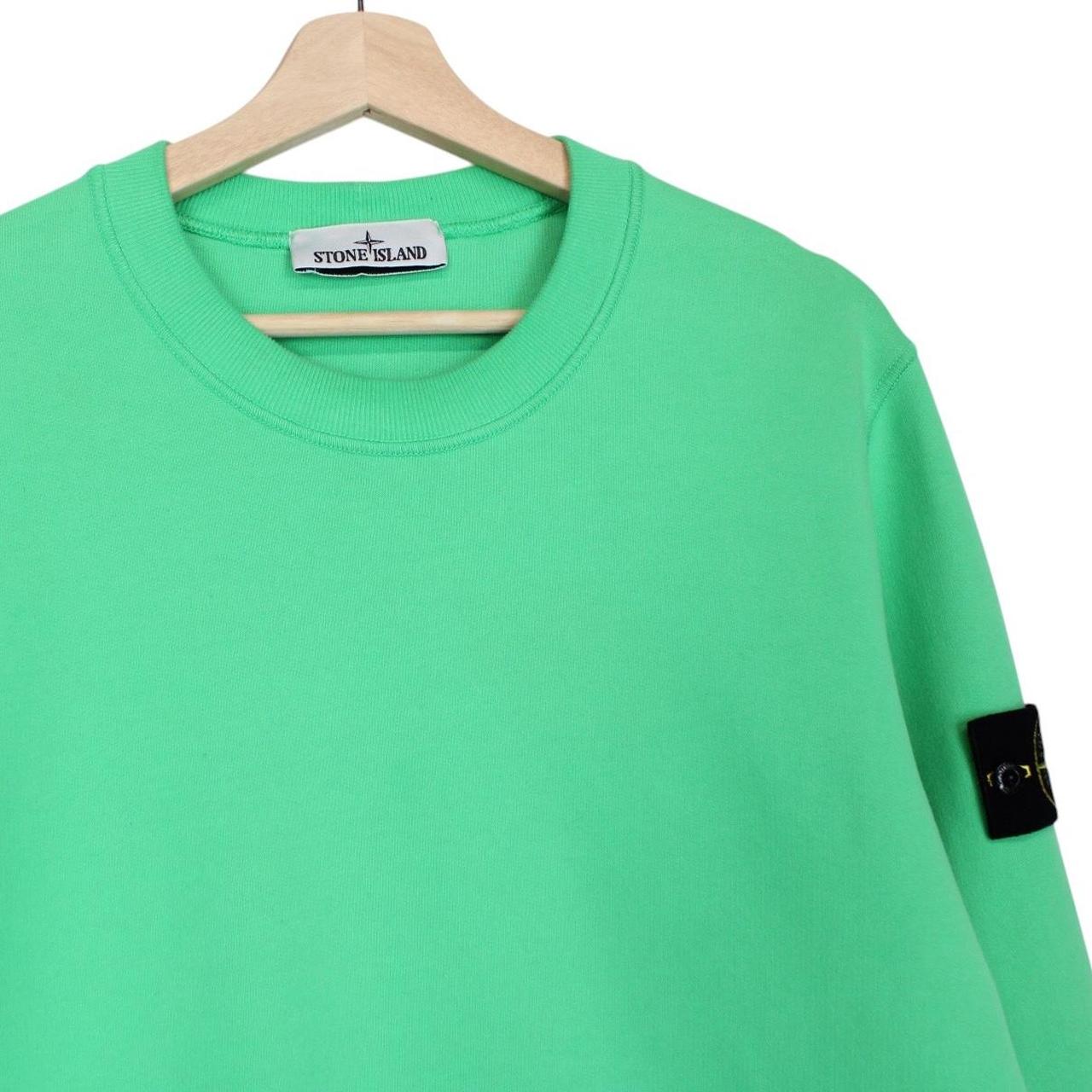 Stone Island green cotton sweatshirt with iconic compass logo and ribbed cuffs.