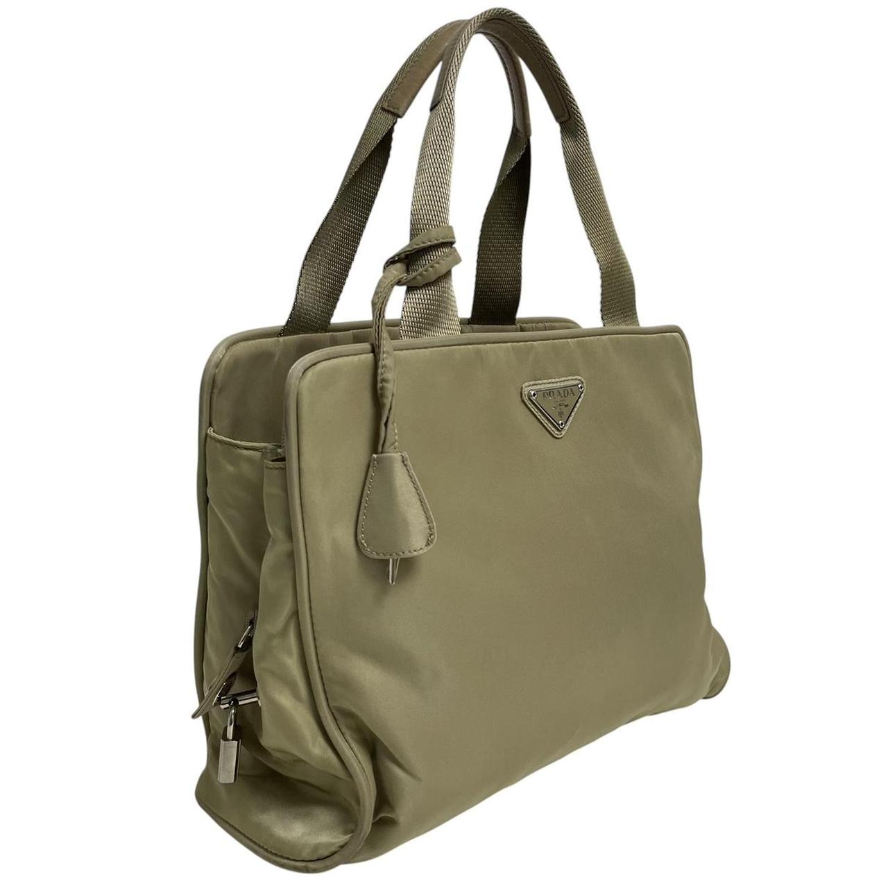 Prada green nylon duffel bag with logo detail and working lock and key.
