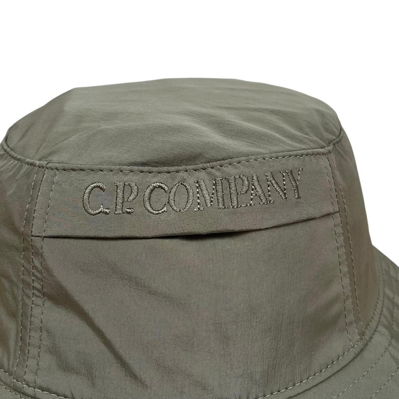 CP Company green bucket hat embroidered logo, made from Chrome-R nylon material.