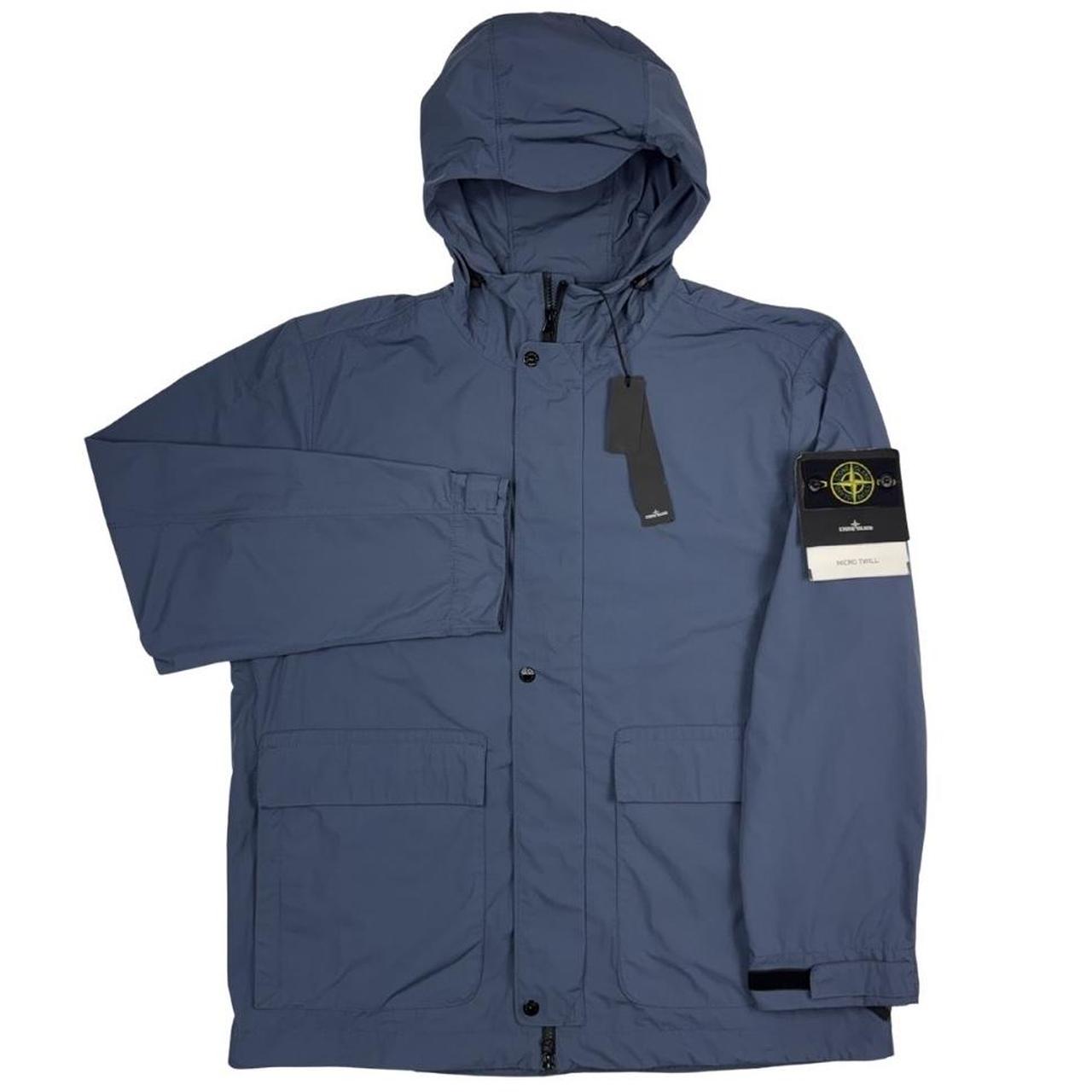 Stone Island blue hooded jacket with logo patch and micro twill fabric.
