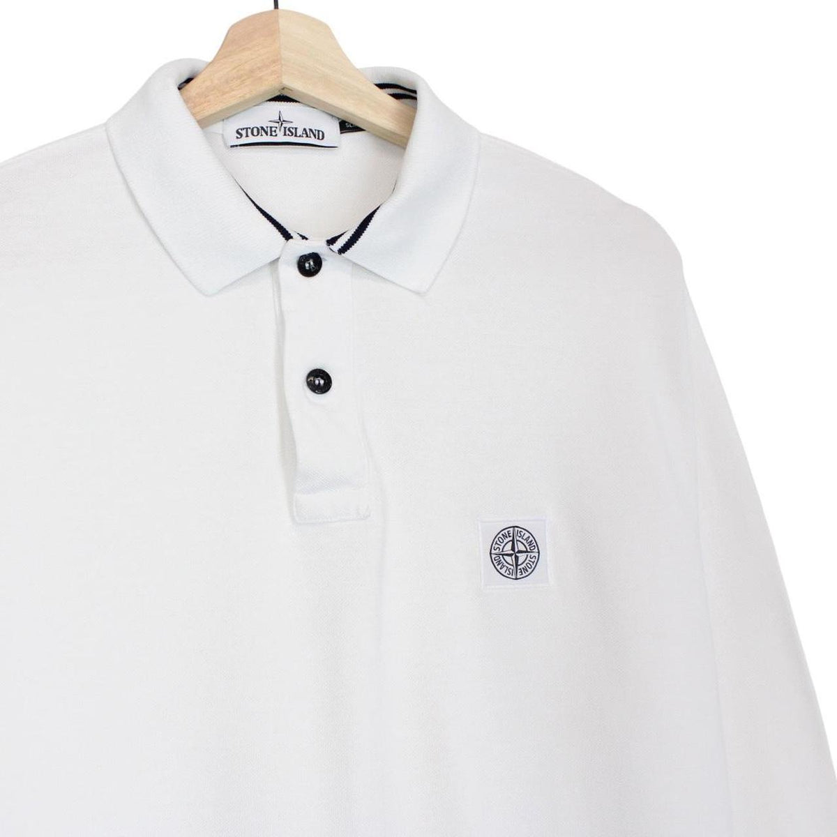 Stone Island white long sleeve polo shirt with embroidered compass logo and slim fit.