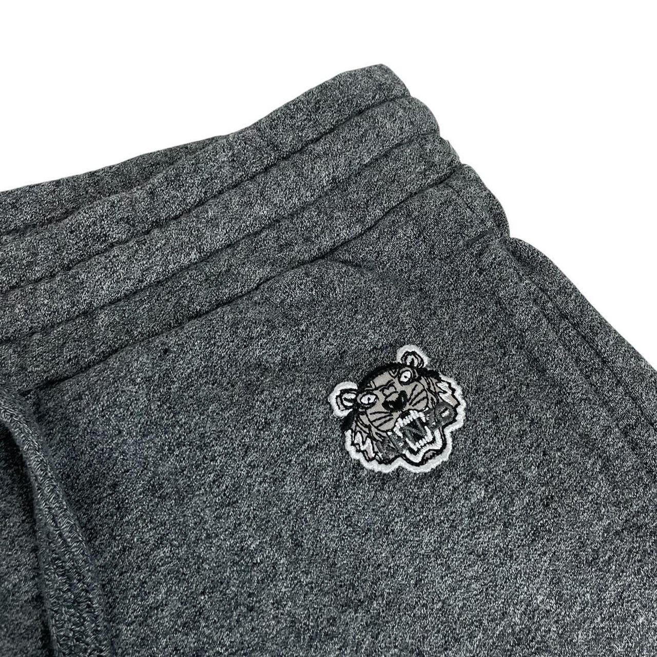 Kenzo grey joggers featuring embroidered tiger logo and soft cotton material.