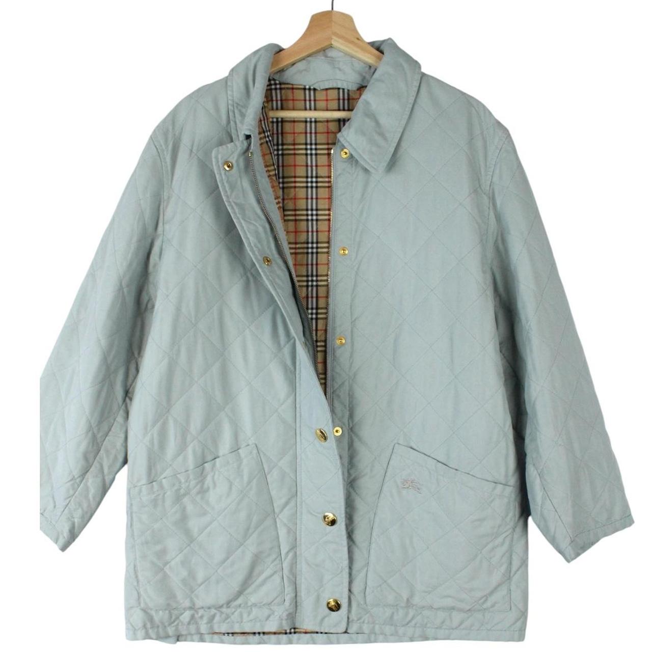 Burberry light blue diamond quilted jacket with Nova Check pattern and logo detail.