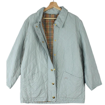 Burberry light blue diamond quilted jacket with Nova Check pattern and logo detail.