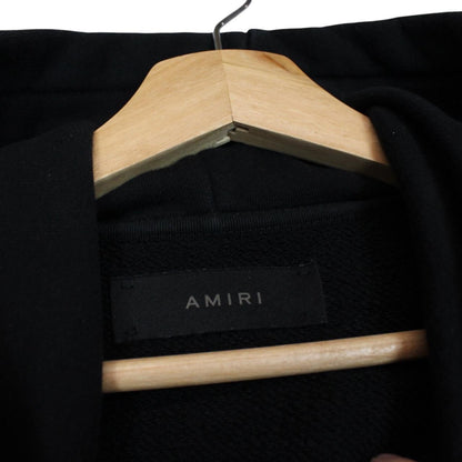 AMIRI black hoodie with rhinestone embellishments and crystal stick poke details.