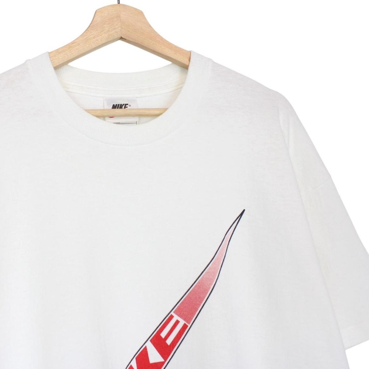 Nike vintage red and white short sleeve cotton t-shirt with logo pocket detail.