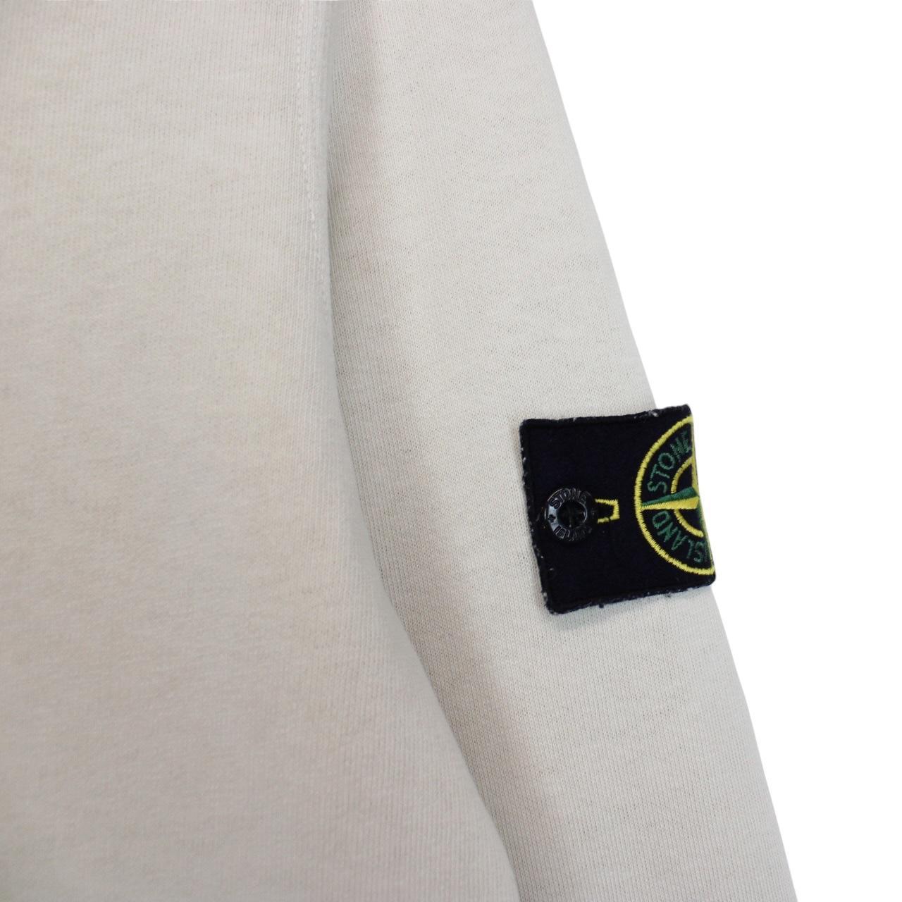 Stone Island beige cotton sweatshirt with logo patch and ribbed cuffs.