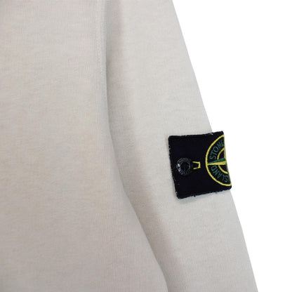 Stone Island beige cotton sweatshirt with logo patch and ribbed cuffs.