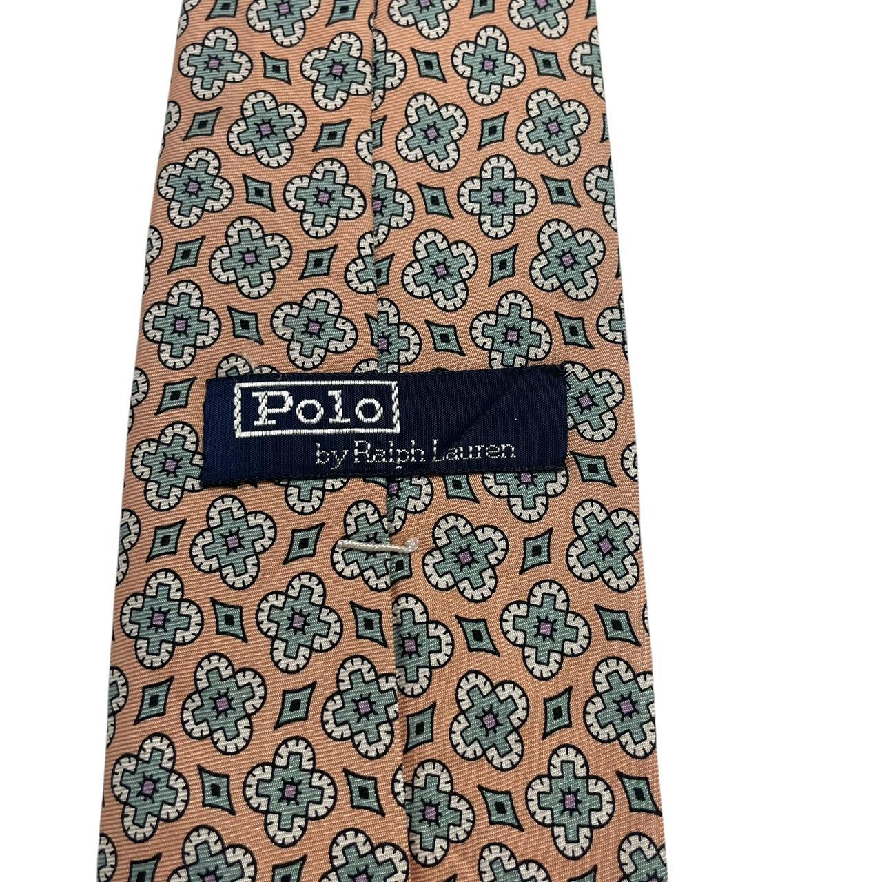 Polo Ralph Lauren multicoloured floral print silk tie with vibrant patterns and smooth texture.
